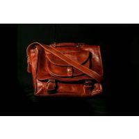 Leather Tour bag front view with strap